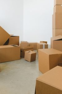 Assorted cardboard boxes arranged in a room, ideal for moving or storage concepts.